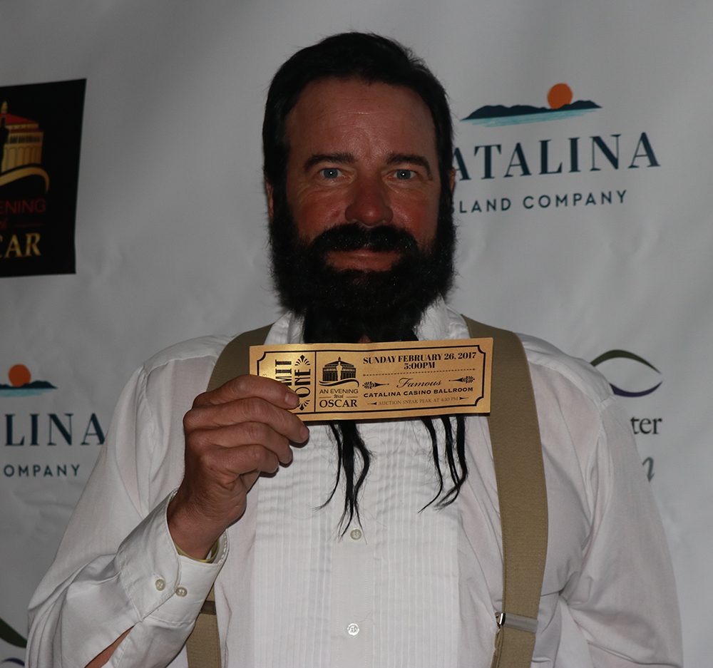 Man holding Evening with Oscar ticket